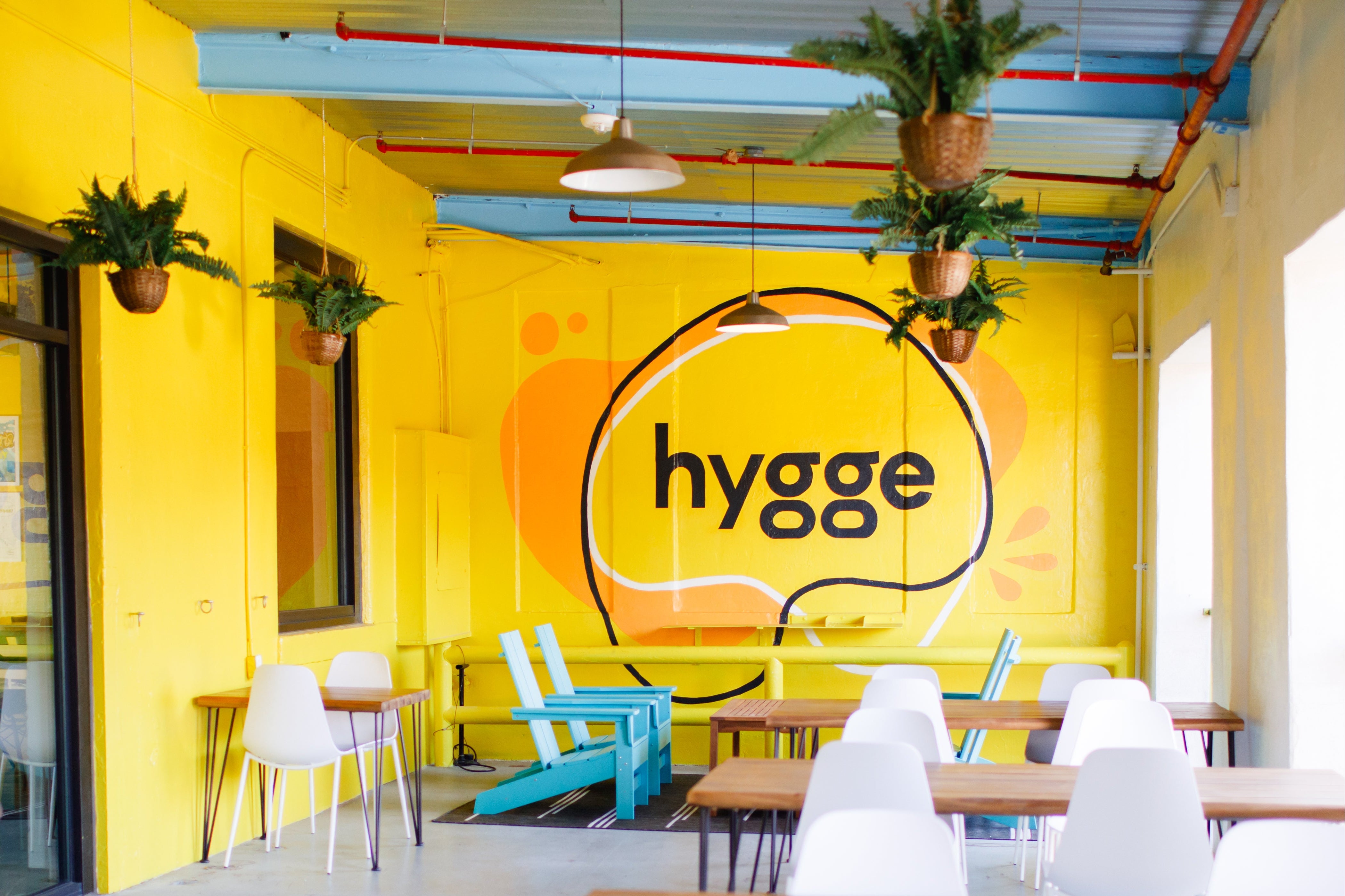 Hygge Coworking Space Mural Typography Artist Yellow Wall Painting Brick Exterior Small Business Charlotte North Carolina