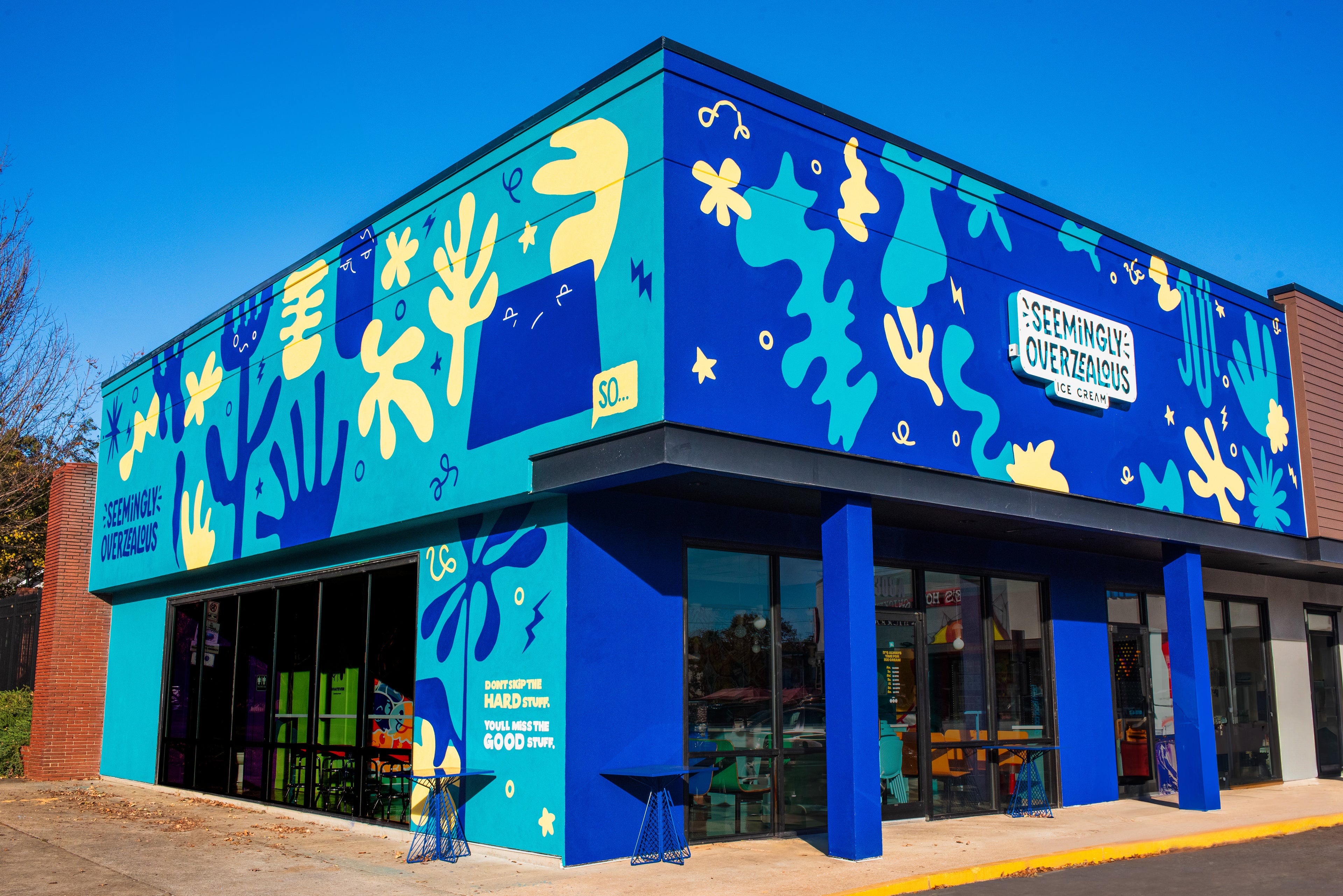 Ice cream shop painted blue wall abstract fun mural artist bold bright colorful wall art exterior charlotte north carolina